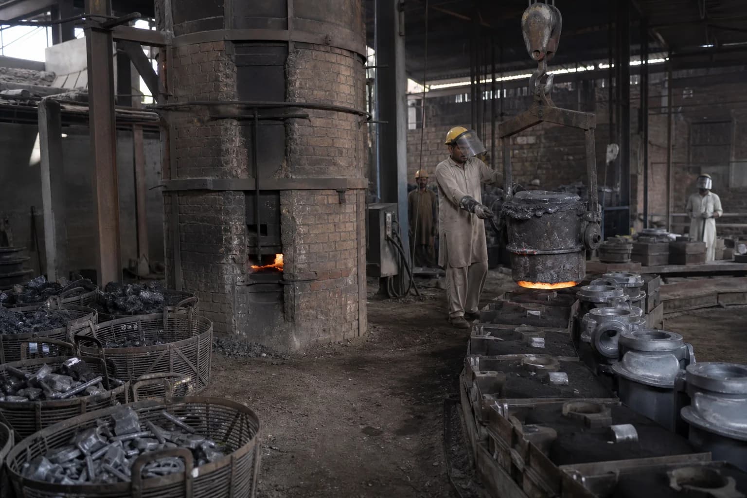 A conventional foundry producing cast-iron parts from ferrous charge